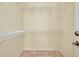 This walk-in closet features wire rack storage and neutral colored walls at 429 Riviera St, Venice, FL 34285