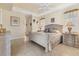 Bedroom featuring a bed and two nightstands at 4403 Via Del Villetti Dr, Venice, FL 34293