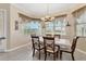 Cozy dining area with a dining table and views of the lanai at 4403 Via Del Villetti Dr, Venice, FL 34293