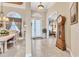 Inviting foyer with tile floors, high ceilings, and elegant decor leading to living spaces at 4403 Via Del Villetti Dr, Venice, FL 34293