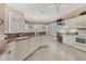 Lovely kitchen area featuring light-colored cabinets and an eating nook at 4403 Via Del Villetti Dr, Venice, FL 34293