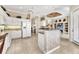 Spacious kitchen with white cabinetry, granite countertops, and a center island at 4403 Via Del Villetti Dr, Venice, FL 34293