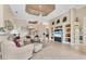 Living room with a view of the dining room, tile floor, and built in shelving at 4403 Via Del Villetti Dr, Venice, FL 34293