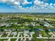 Aerial view of a community showcasing houses, waterway and overall layout and design at 447 Rotonda Cir, Rotonda West, FL 33947