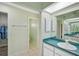 The bathroom has a vanity with a sink and a separate toilet area at 447 Rotonda Cir, Rotonda West, FL 33947