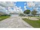 Charming home with a well-maintained lawn, driveway, and American flag at 447 Rotonda Cir, Rotonda West, FL 33947