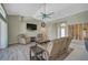 Bright living room featuring tile and wood floors, neutral walls, and plenty of seating at 447 Rotonda Cir, Rotonda West, FL 33947