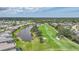 This amazing view shows the pond and golf course of the neighborhood at 4532 Chase Oaks Dr, Sarasota, FL 34241