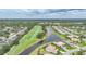 Beautiful aerial view of a community on a golf course with a lake at 4532 Chase Oaks Dr, Sarasota, FL 34241