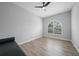 Empty bedroom featuring luxury vinyl plank flooring, one window, and one baseboard heater at 4532 Chase Oaks Dr, Sarasota, FL 34241