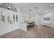 Dining area adjacent to the entrance, features modern lighting, hardwood floors, and ample seating at 4532 Chase Oaks Dr, Sarasota, FL 34241