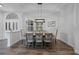 Dining room featuring modern lighting, hardwood floors, and ample space for entertaining guests at 4532 Chase Oaks Dr, Sarasota, FL 34241