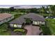 Exterior shot of this beautiful property with mature landscaping at 4532 Chase Oaks Dr, Sarasota, FL 34241