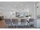 Bright kitchen showcasing a large island, custom cabinets, and an open floor plan that connects living areas at 4532 Chase Oaks Dr, Sarasota, FL 34241