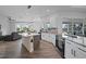 Modern kitchen with an island, pendant lighting, and sleek appliances with easy access to the living area at 4532 Chase Oaks Dr, Sarasota, FL 34241