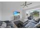 Spacious living room with a flat screen tv, comfortable seating, and bay windows providing ample natural light at 4532 Chase Oaks Dr, Sarasota, FL 34241