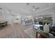 Open-concept living room flows seamlessly into the kitchen and dining area, perfect for entertaining and everyday living at 4532 Chase Oaks Dr, Sarasota, FL 34241