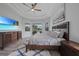 Bright main bedroom with comfortable furnishings, a ceiling fan, and views of the outdoor living space at 4532 Chase Oaks Dr, Sarasota, FL 34241