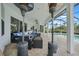 Covered patio with ceiling fans, propane heaters, and outdoor seating next to a pool at 4532 Chase Oaks Dr, Sarasota, FL 34241