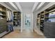 Spacious walk-in closet with custom shelving, ample storage, and access to the Primary bathroom at 4532 Chase Oaks Dr, Sarasota, FL 34241