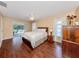 Bright main bedroom featuring hardwood floors and a ceiling fan at 455 Rubens E Dr, Nokomis, FL 34275