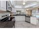 Bright kitchen with white cabinets, stainless steel appliances and tile backsplash at 455 Rubens E Dr, Nokomis, FL 34275