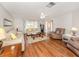 Bright and airy living room featuring wood floors and comfortable seating arrangements at 455 Rubens E Dr, Nokomis, FL 34275