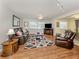 Bright living room with hardwood floors and cozy seating at 455 Rubens E Dr, Nokomis, FL 34275