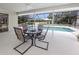 Covered patio with a view of the pool at 455 Rubens E Dr, Nokomis, FL 34275