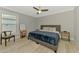 Bedroom with a ceiling fan, window, and hardwood floors at 4624 Caribou Ave, North Port, FL 34287