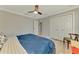 Bedroom with hardwood floors, a ceiling fan, and a closet at 4624 Caribou Ave, North Port, FL 34287