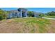 Charming house with lush green grass and beautiful landscaping adding to its curb appeal at 4624 Caribou Ave, North Port, FL 34287