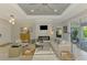 Bright living room boasts a stylish fireplace and access to the outdoor patio with natural lighting at 4624 Caribou Ave, North Port, FL 34287