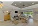 Open concept living room featuring light flooring, recessed lighting, modern furniture, and fireplace at 4624 Caribou Ave, North Port, FL 34287