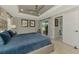 Spacious main bedroom with a tray ceiling, neutral paint, and access to outdoor space at 4624 Caribou Ave, North Port, FL 34287