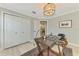 Office with a modern light fixture, closet, and neutral colored walls at 4624 Caribou Ave, North Port, FL 34287