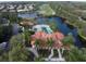Aerial view showcasing the community pool and amenities in a beautiful resort-like setting at 515 Sawgrass Bridge Rd, Venice, FL 34292
