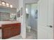 Bright bathroom featuring a walk-in shower, vanity and toilet room at 515 Sawgrass Bridge Rd, Venice, FL 34292