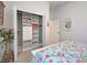 Bright bedroom with a walk-in closet and a door to the bathroom at 515 Sawgrass Bridge Rd, Venice, FL 34292