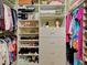 The main bedroom's walk-in closet has ample storage and custom shelving at 515 Sawgrass Bridge Rd, Venice, FL 34292