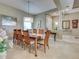The home's formal dining room has seating for eight and stylish decor at 515 Sawgrass Bridge Rd, Venice, FL 34292