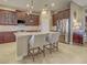 Open kitchen with stainless steel appliances, granite countertops, and a breakfast bar with seating at 515 Sawgrass Bridge Rd, Venice, FL 34292