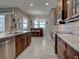 Spacious kitchen featuring stainless steel appliances, a breakfast bar, and a separate wet bar at 515 Sawgrass Bridge Rd, Venice, FL 34292