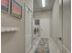 Convenient laundry room featuring modern washer and dryer, storage, and neutral wall color at 515 Sawgrass Bridge Rd, Venice, FL 34292