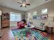 Bright living room featuring hardwood floors, high ceilings, and comfortable seating at 515 Sawgrass Bridge Rd, Venice, FL 34292