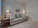 Living room with neutral walls, plush carpeting, and cozy seating for a welcoming ambiance at 515 Sawgrass Bridge Rd, Venice, FL 34292