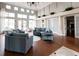 Bright, modern lounge with stylish seating, hardwood floors and French doors welcomes visitors at 515 Sawgrass Bridge Rd, Venice, FL 34292
