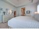 The home's main bedroom is spacious and has an ensuite bathroom at 515 Sawgrass Bridge Rd, Venice, FL 34292