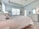 Main bedroom offers plenty of natural light, tray ceiling, and a dresser at 515 Sawgrass Bridge Rd, Venice, FL 34292