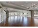 Large meeting room with tile ceiling, ceiling fans, and natural light provides versatility at 515 Sawgrass Bridge Rd, Venice, FL 34292